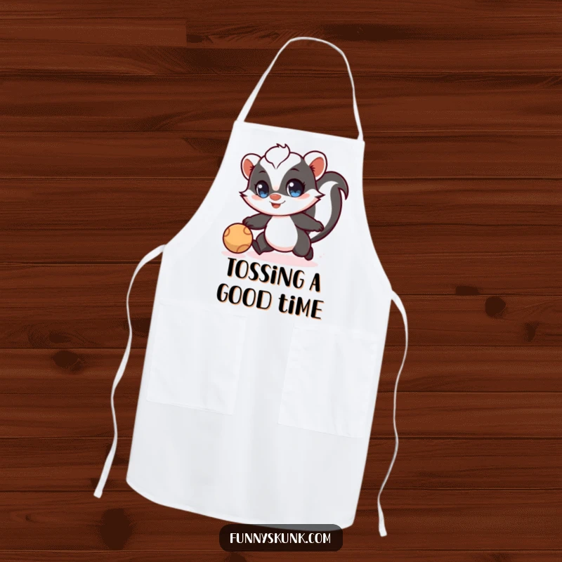 Funny skunk apron with a skunk having wide eyes, playfully chasing a bouncing ball, ideal for kitchen fun.