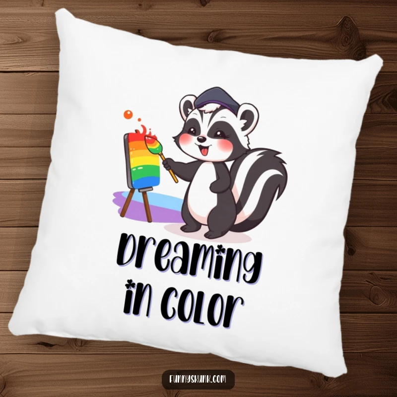 Funny decorative pillow featuring a cute skunk in a beret, joyfully painting a colorful rainbow, perfect for adding whimsical art to any room.