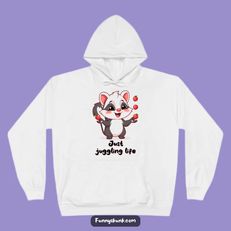 Cozy Funny Skunk Juggling Hoodie: Grinning Berry Acrobat Design, Warm Funny Gift