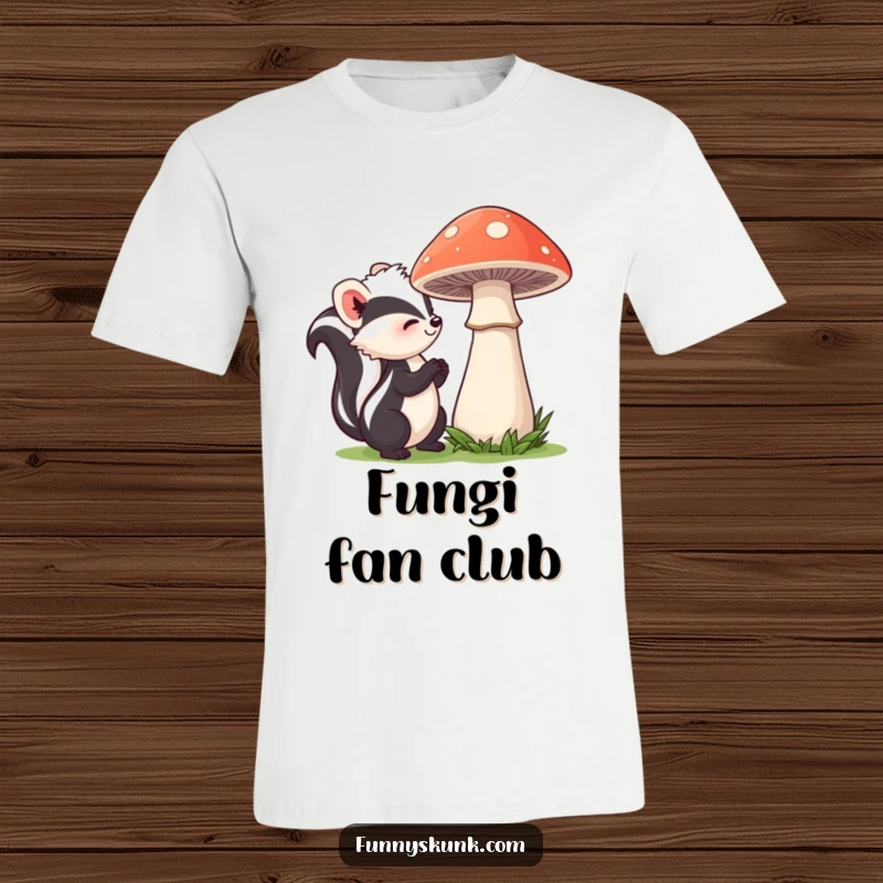 Funny skunk t-shirt featuring a curious skunk with a mild smile, delicately sniffing a large, bashful mushroom, embodying a peaceful forest scene.
