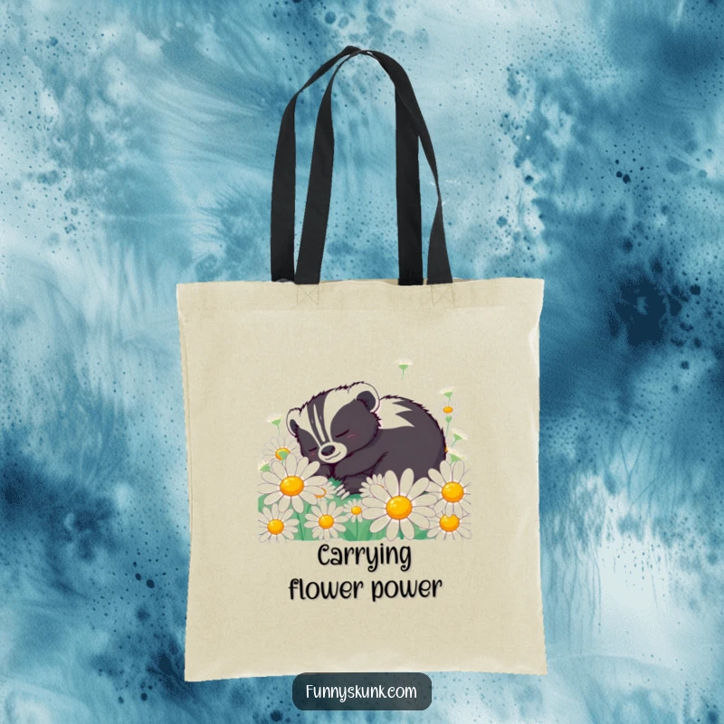 Funny skunk tote bag showcasing a content skunk napping peacefully in oversized daisies, perfect for carrying calm and humor.
