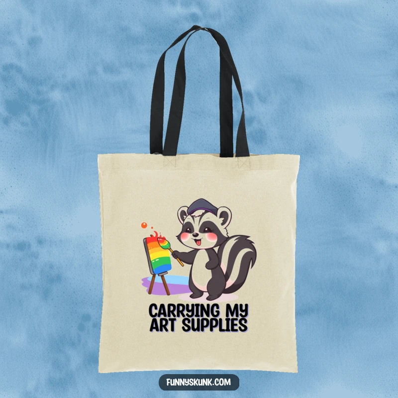 Funny tote bag featuring a cute skunk wearing a beret, joyfully painting a colorful rainbow, perfect for carrying art supplies or daily essentials.
