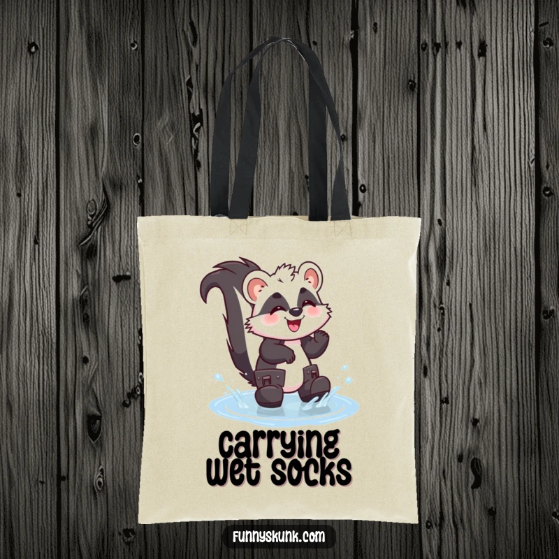 Funny skunk tote bag showing a giggling skunk in oversized boots splashing happily in a puddle, perfect for carrying wet fun.